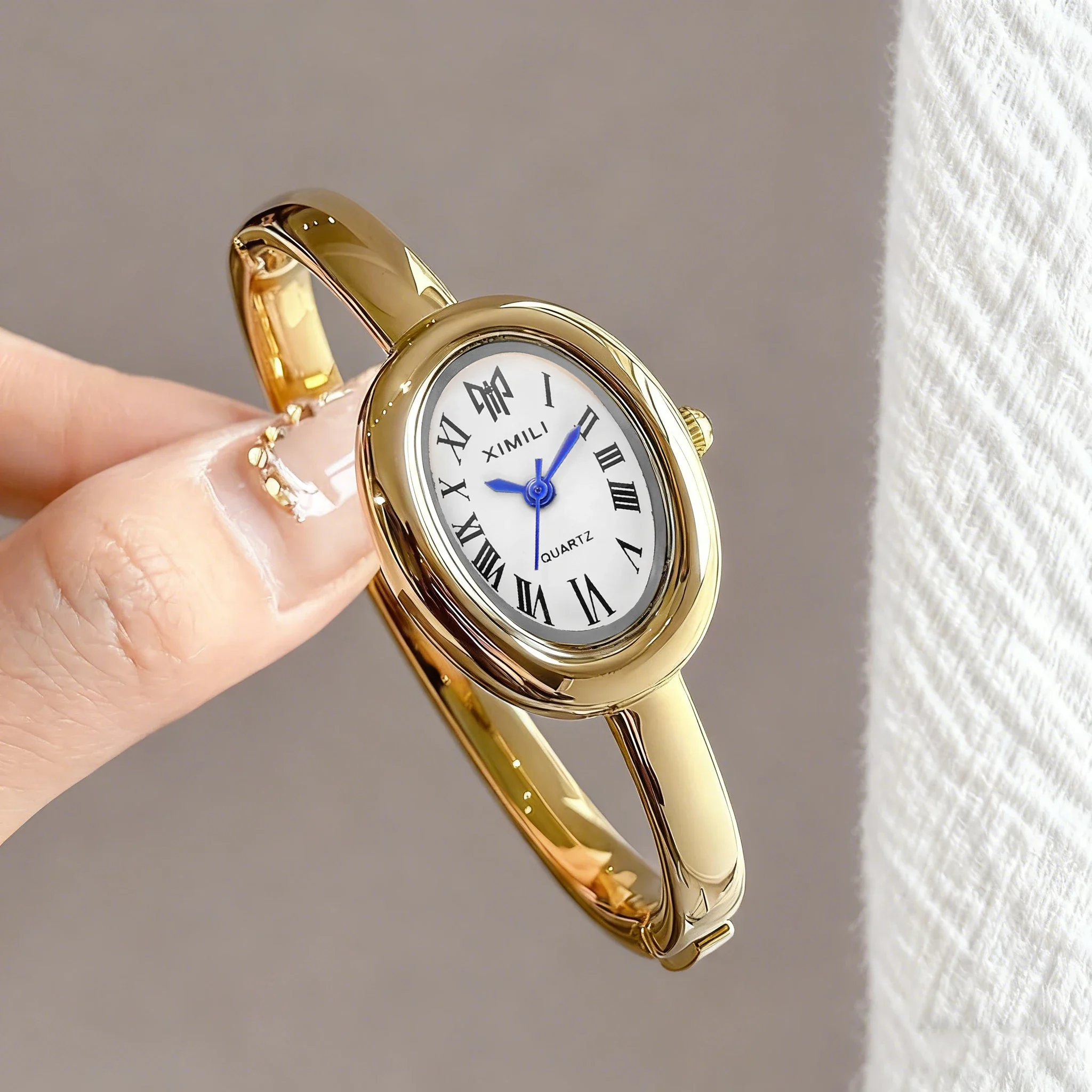Oval women's bracelet watch, antique gold watch, Roman bracelet style