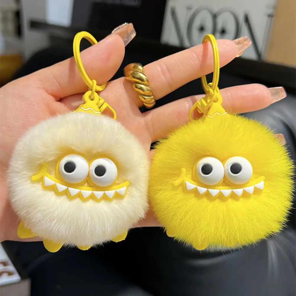 

Плюшевый брелок-монстр: мягкий пушистый меховой шарик с большими глазами и зубами, привлекательный аксессуар для сумок, ключей, рюкзаков, забавный подарок