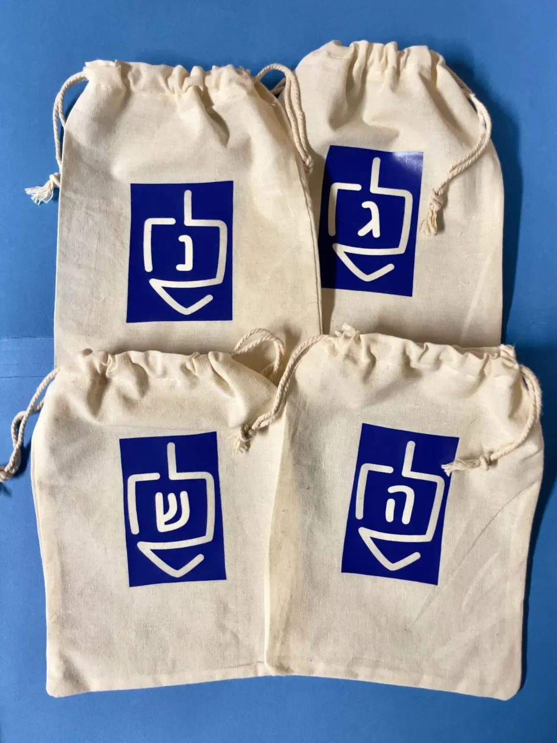 

5x7 Inch 4pcs HANUKKAH Drawstring Gift Bags 2 Different Sets Available Dreidels for Hanukkah Variety Favor Bags Chanukah Party