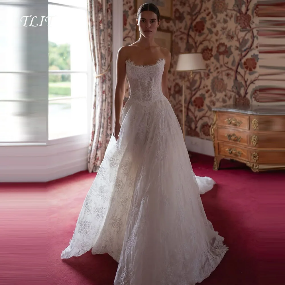 TLIT فساتين زفاف فاخرة من الدانتيل العاجي على شكل حرف a مخصصة على شكل قلب فساتين زفاف سويب تراين بدون أكمام فستان زفاف #1