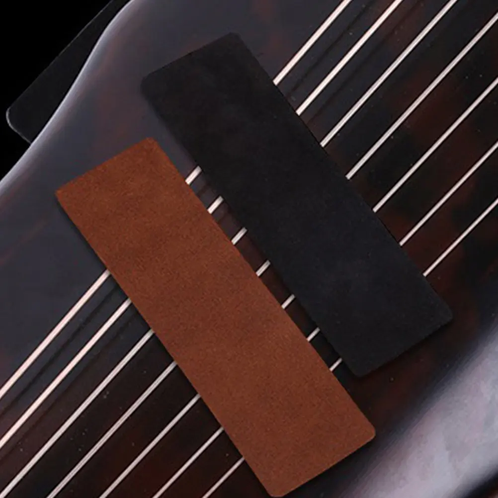 

2 шт. Нескользящие утолщенные накладки для гучжэна, двусторонние флисовые, из воловьей кожи, противоскользящие, для гитары, укулеле, аксессуар для музыкальных инструментов