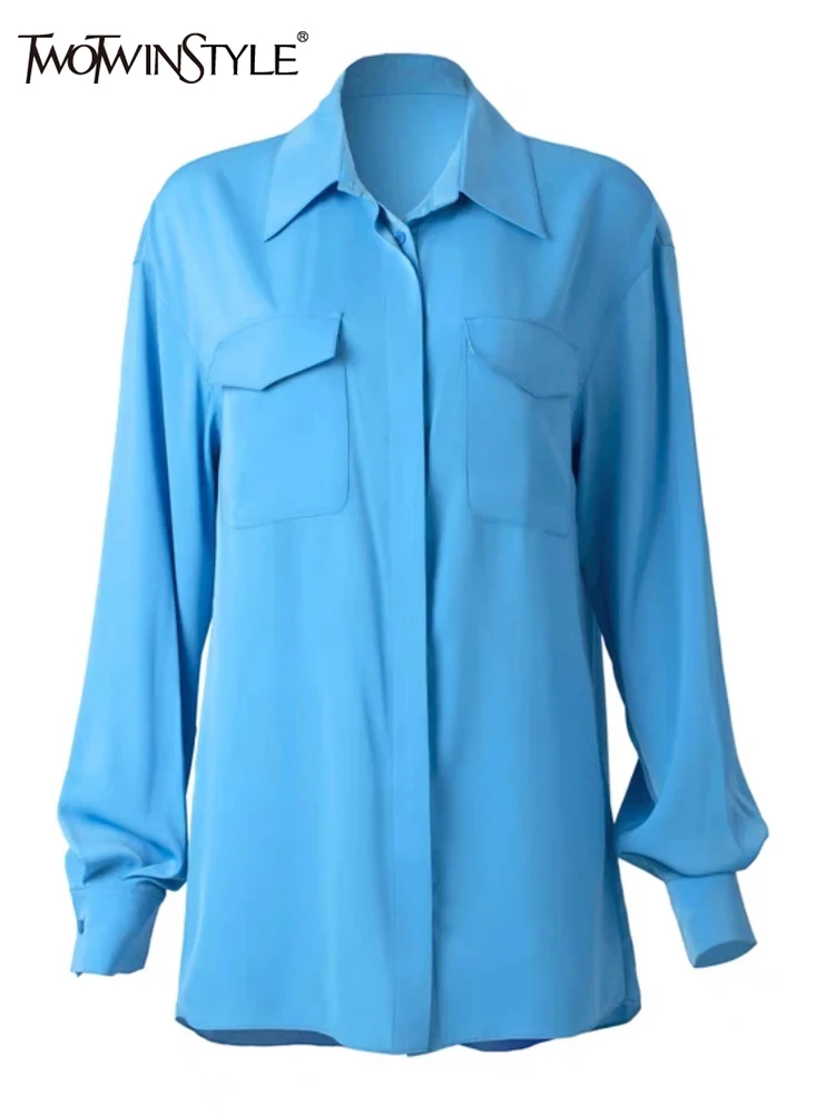 

TWOTWINSTYLE Solid Minimalist Spliced Pocket Shirt For Women Lapel Long Sleeve Patchwork Button Temperament Blouses Female New