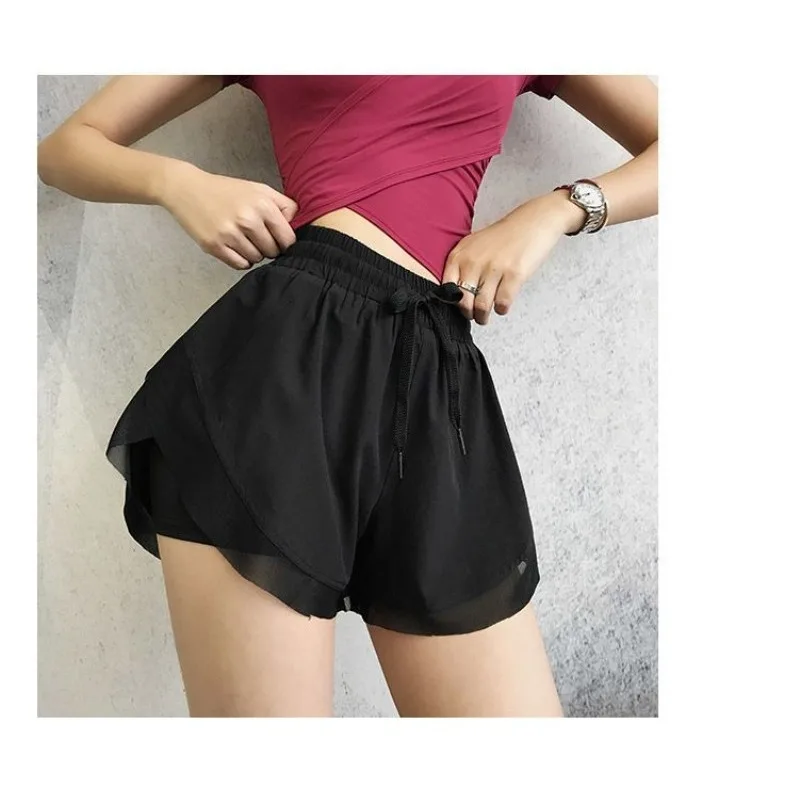 Shorts esportivos femininos de verão, calças soltas de ioga casuais discretas com cobertura de carne