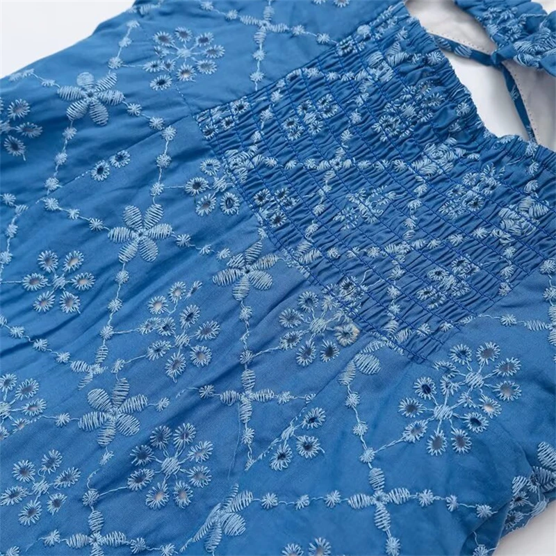 Keyanketian 2025 verão novo vestido feminino bordado deslizamento beachwear férias vento sem costas oco em camadas sem mangas mini vestido