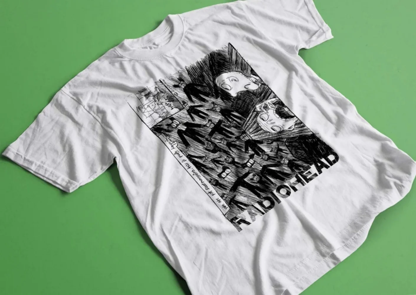 

RADIOHEAD SCRIBBLE 2000 White Retro T-shirt – Vintage scribble print, nods to the band’s 2000-era vibe for fan outfits or gigs