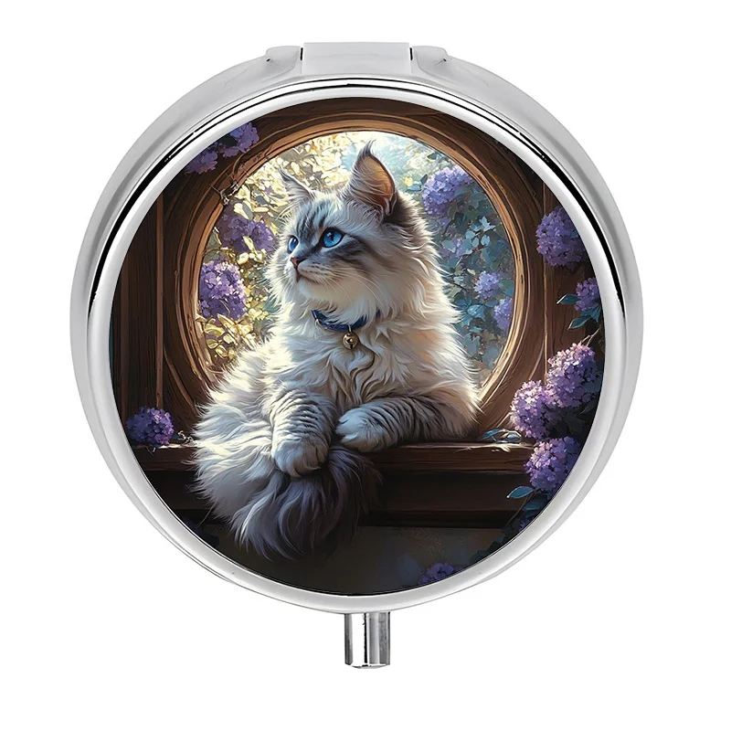 A mini travel pill box with a cat and flower design, featuring three compartments. This mini decorative storage box is perfect for storing medication and can easily fit into a purse or wallet.