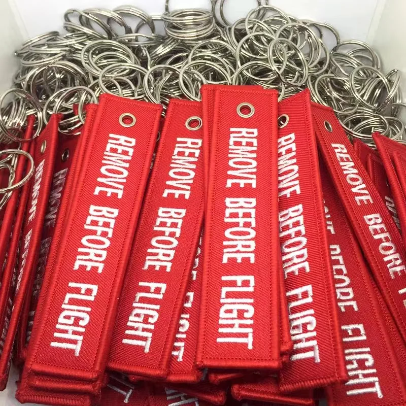 SOMEHOUR 12 PCS Wholesale Aviation Keychain Remove Before Flight Both Embroidery Backpack Accessory For Motorcycles Cars Key