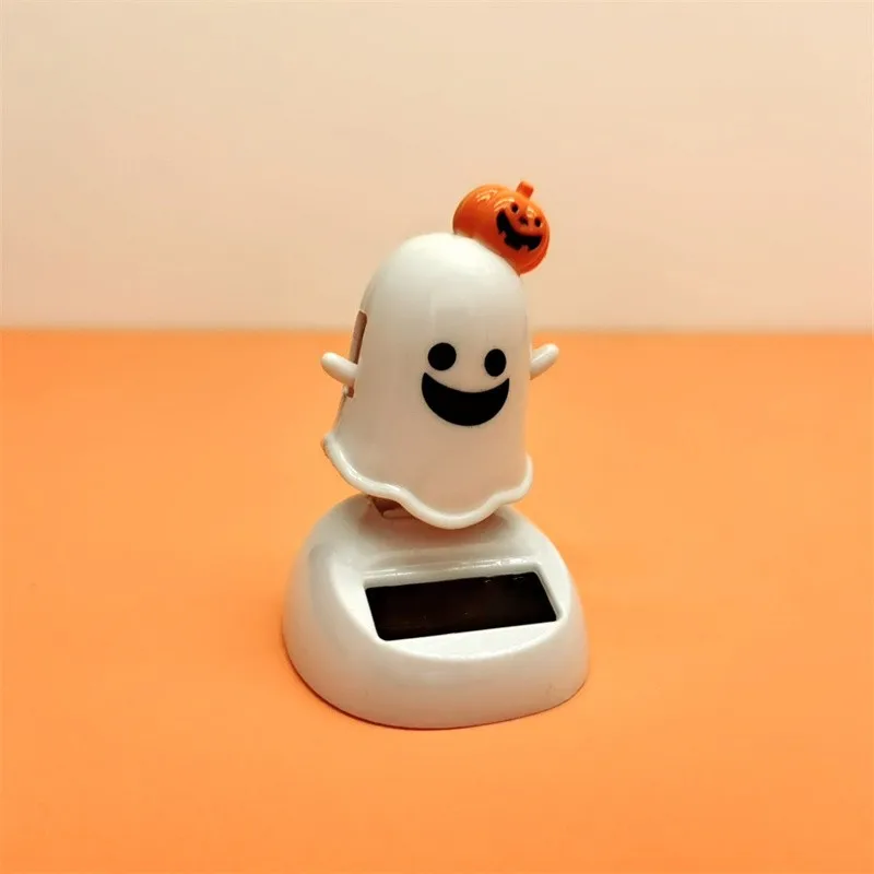 

Halloween Happy Ghost Solar Toy Funny Cartoon Cute White Pumpkin Ghost Swinging Doll Desktop Decorations Solar Car Ornament