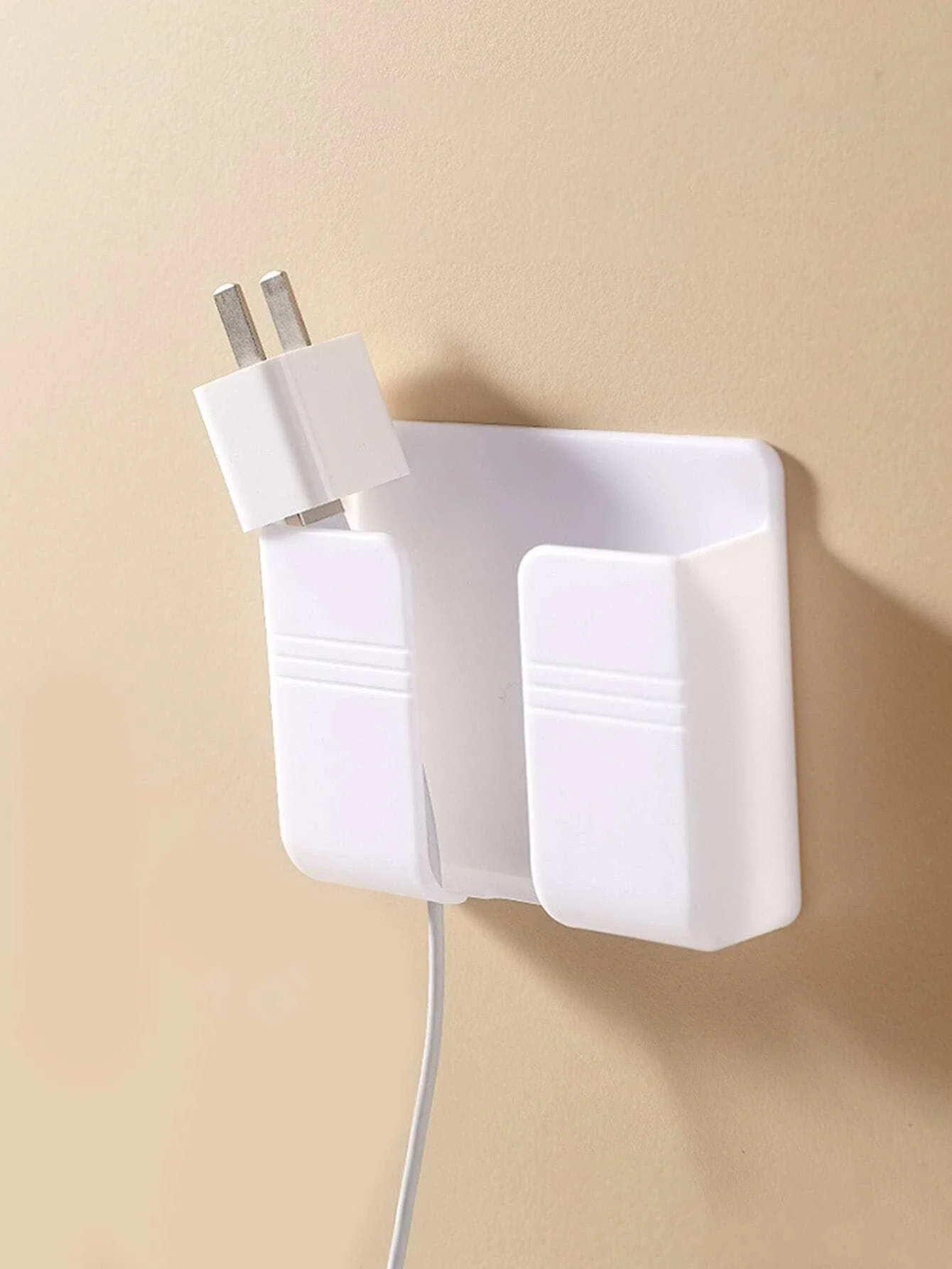 1 soporte para teléfono montado en la pared.