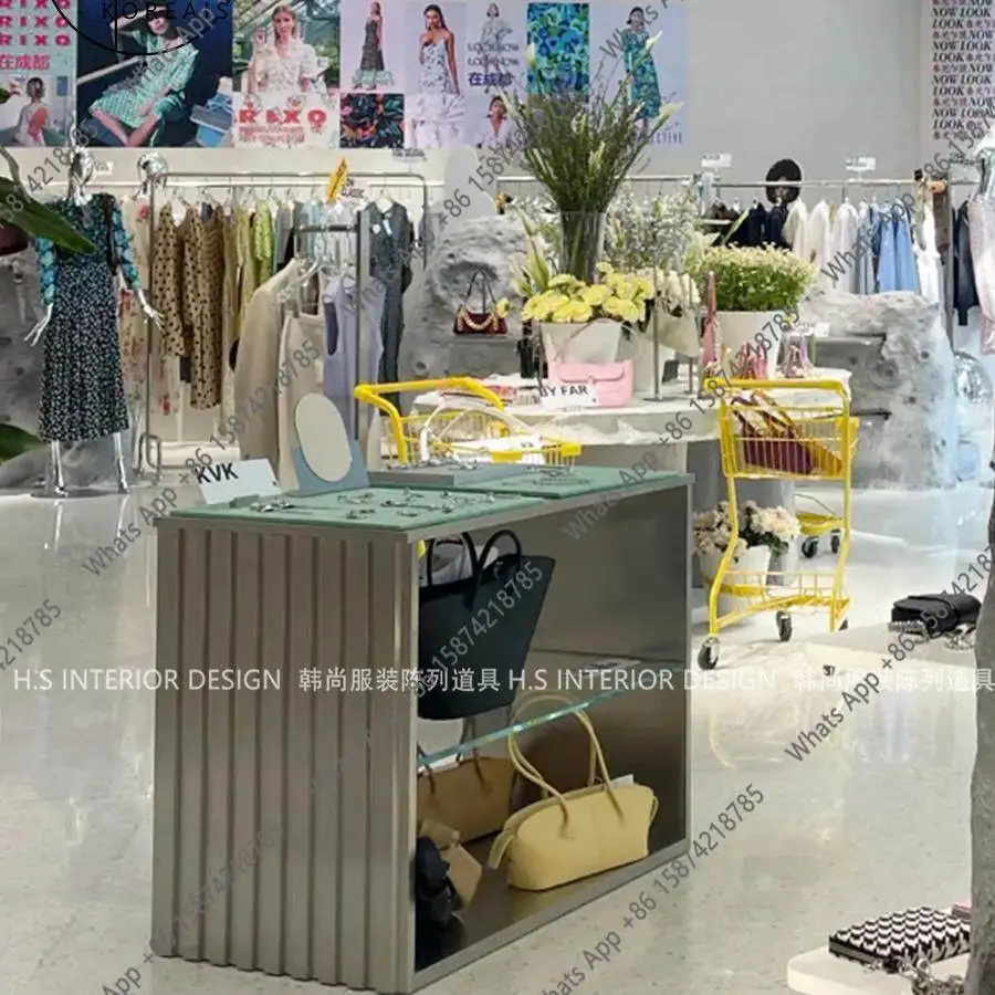 

Clothing store custom Nakajima display table Stainless steel multi-layer jewelry display table in the middle of the water table