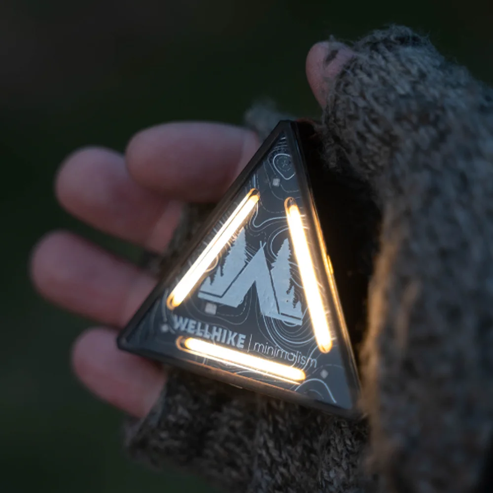 

An outdoor camping triangle light - multi-functional warning, miniature design, suitable for hanging on tents, bicycle racks