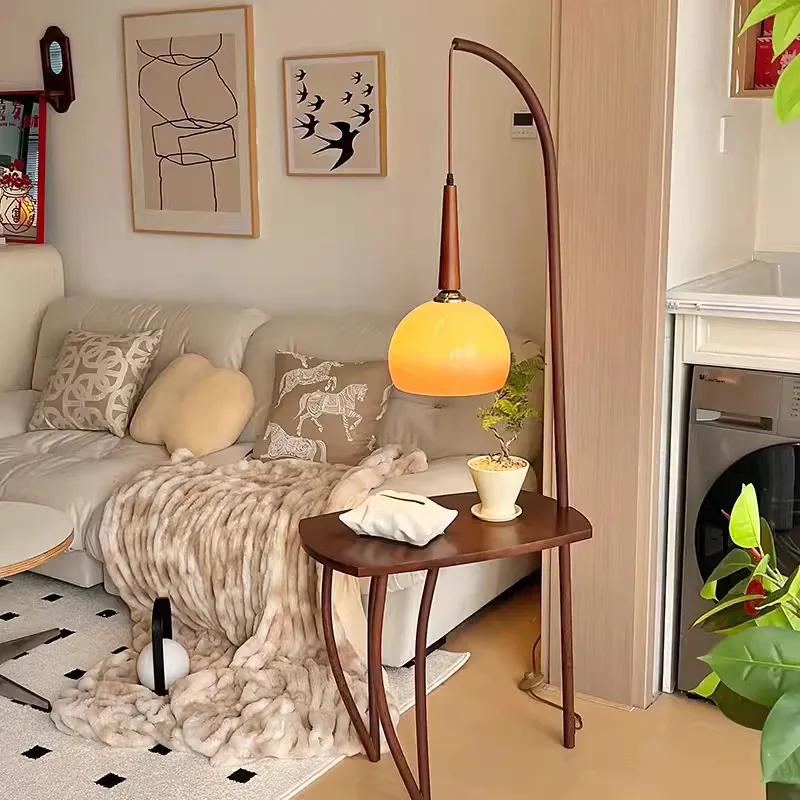

Medieval living room floor lamp American retro sofa next to a few ornaments integrated coffee table fishing grapefruit