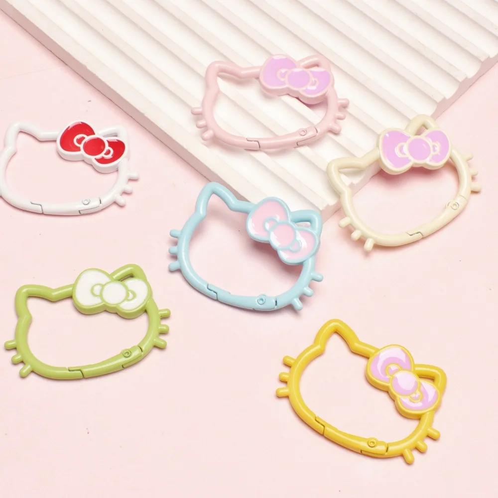 Miniso candy color paint hollow bow cat spring buckle color open spring coil metal hanging buckle accessories