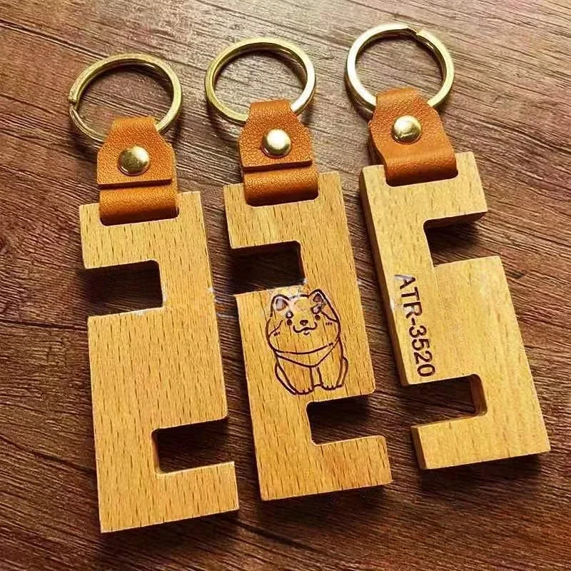 

Customized Logo Wooden Mobile Phone Holder Keychain Creative Portable DIY Keyring Leather Buckle Key Chains Pendant Gift