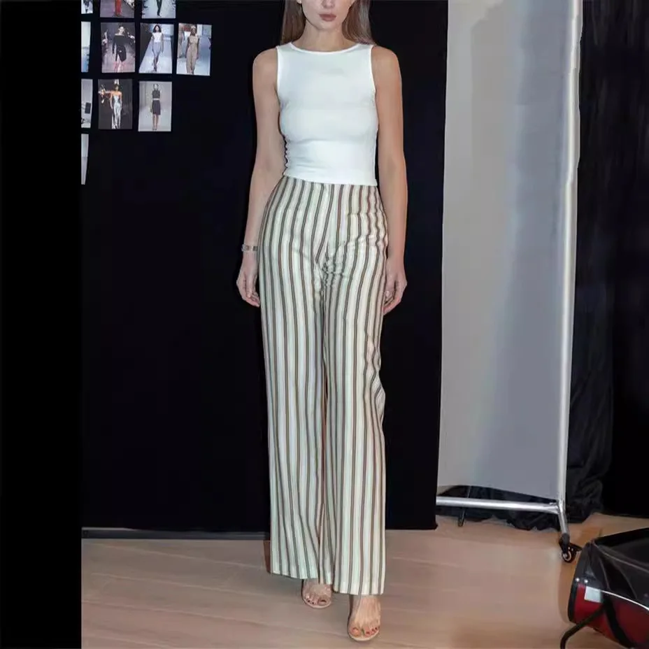 7604 14 Igłowy szew okrągłego dekoltu, bez rękawów, ukrywający bok piersi, regularne ramiączka, nieregularny top na ramiączkach + elastyczna spódnica z rozcięciem i elastyczną talią