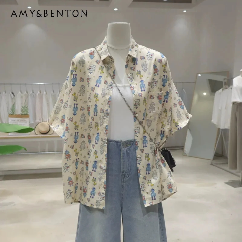 

Women's 2026 Summer Breathable Versatile All-Over Cartoon Robot Print Blusas Loose Mid-Length Cotton Short Sleeved Casual Shirt