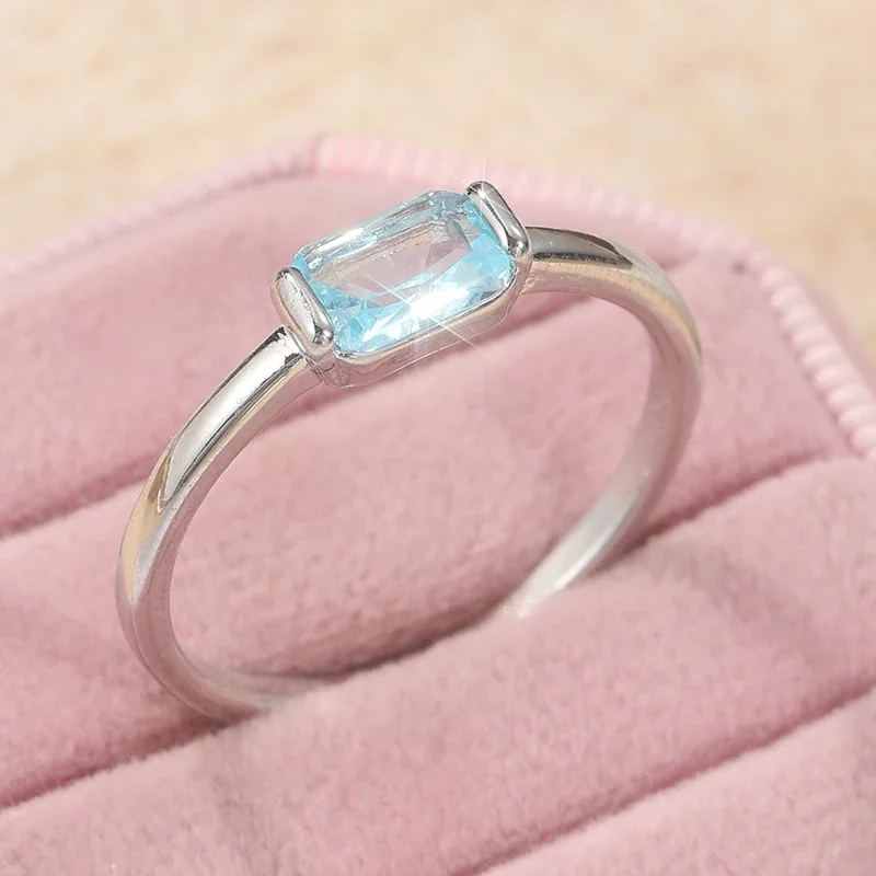 A vintage and minimalist copper material ring hand-set with light blue synthetic zircon by artisans