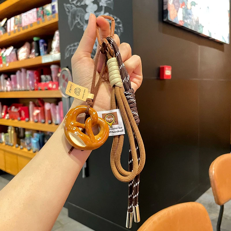 الإبداعية Bowknot المنسوجة حبل المفاتيح الشوكولاته الخبز الخبز المفاتيح البوليستر مكافحة خسر حقيبة الديكور المنسوجة