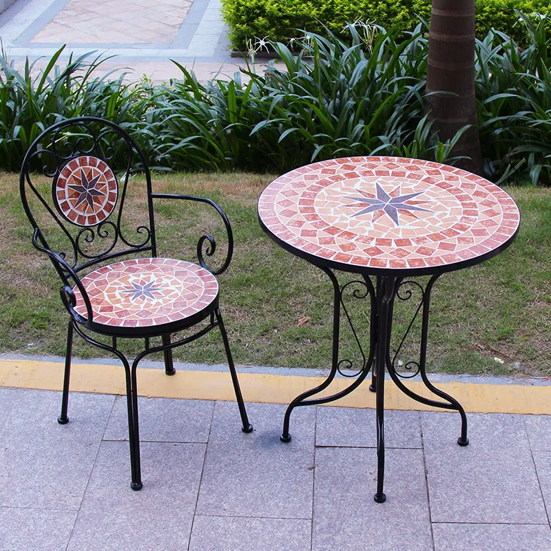 Wrought iron balcony, casual mosaic table and chair combination, European room, outdoor courtyard garden