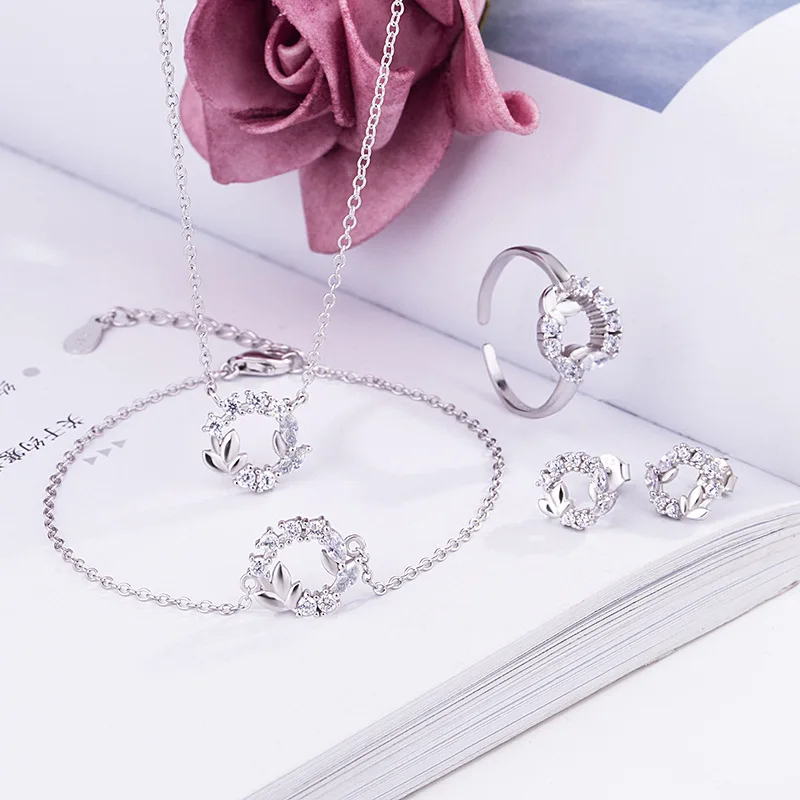 

Wholesale 925 Sterling Silver Flower Jewelry Set from China Rhodium Plated with Zircon Main Stone and Charm Pendants