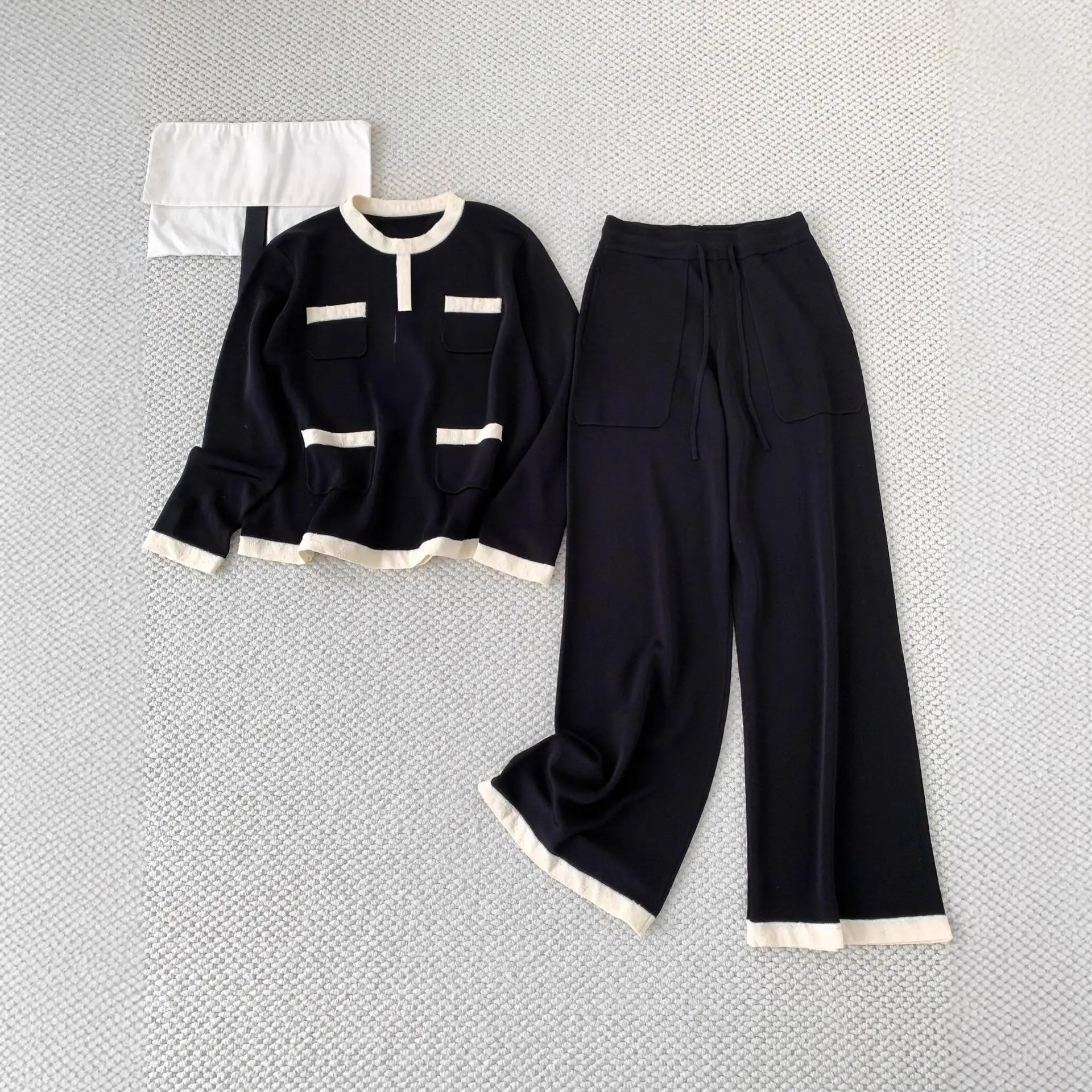 

Spring 2026 Early round Neck Pocket Top Wide Leg Pants Set Black White Cleanfit Style Casual Pants mid Low Waist PVC Material