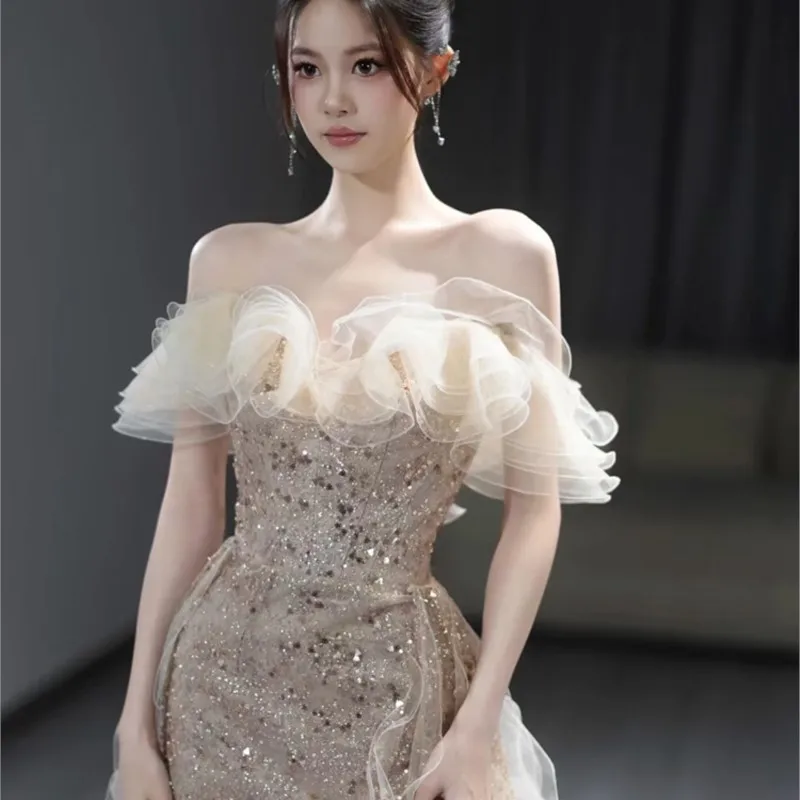 

Champagne one-shoulder banquet Light luxury fishtail sequin style host dress