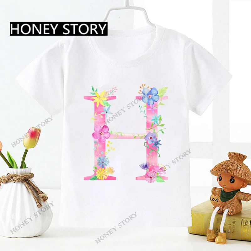 Camiseta informal de manga corta para niños y niñas, Camiseta con estampado de dibujos animados, 26 letras en inglés, nombre de flor, ABC, cuello redondo