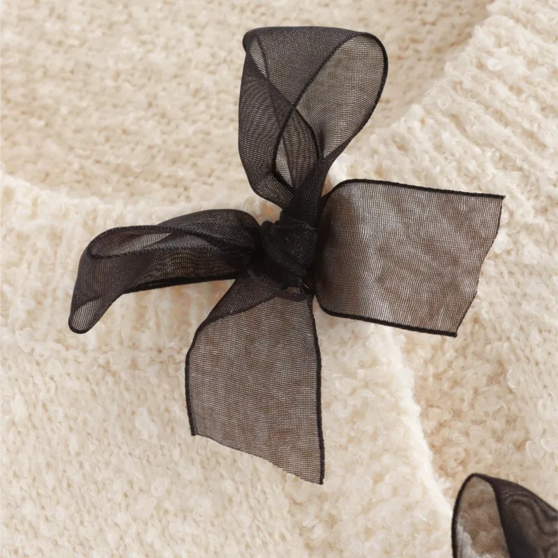 Set di gonne corte maglione lavorato a maglia morbido beige autunno inverno giacca con fiocco in rete dolce + gonna sottile con nappe abiti da donna di moda