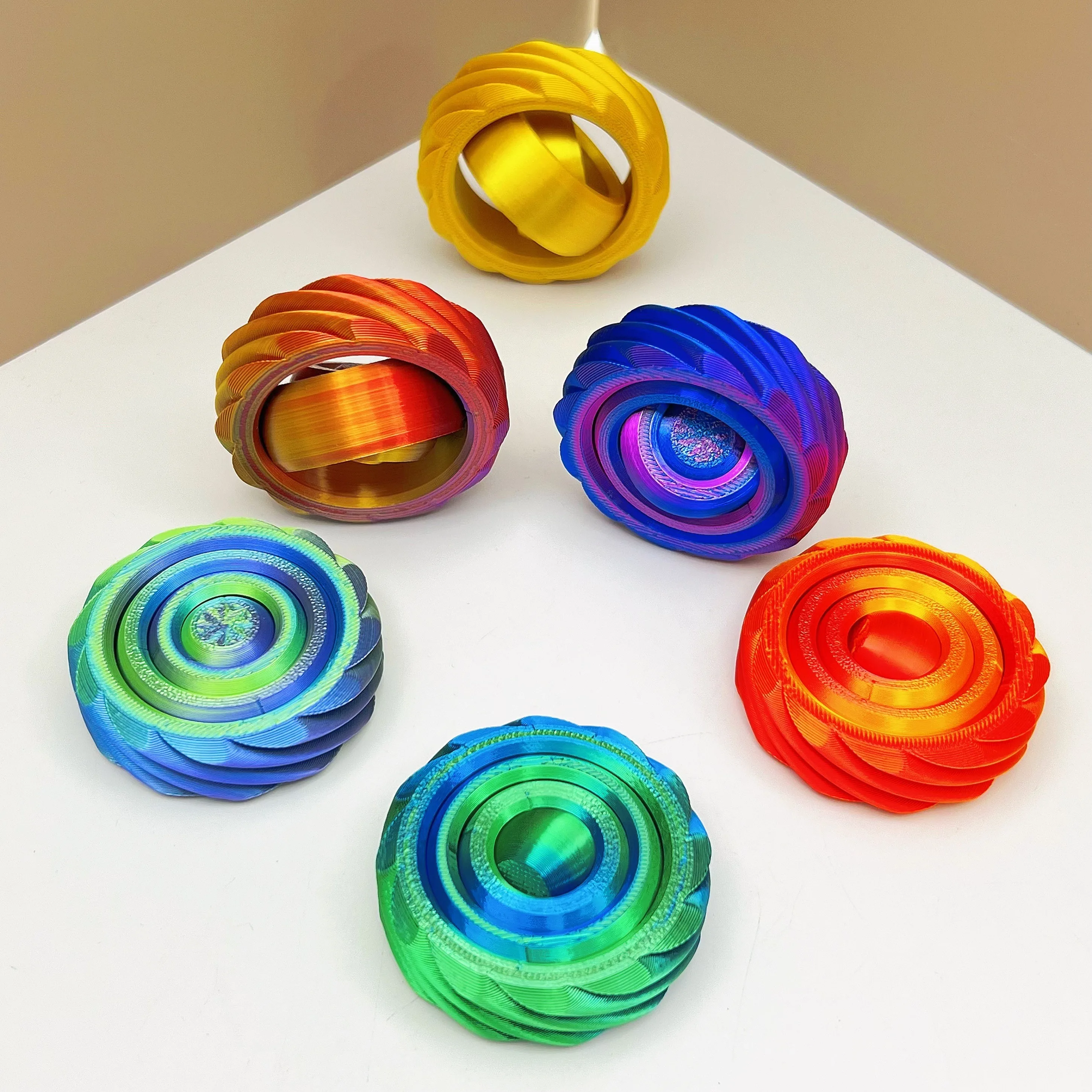 

3D printed rotary gyroscope suitable for office desks and home decor with gradient colors, durable and vibrant patterns