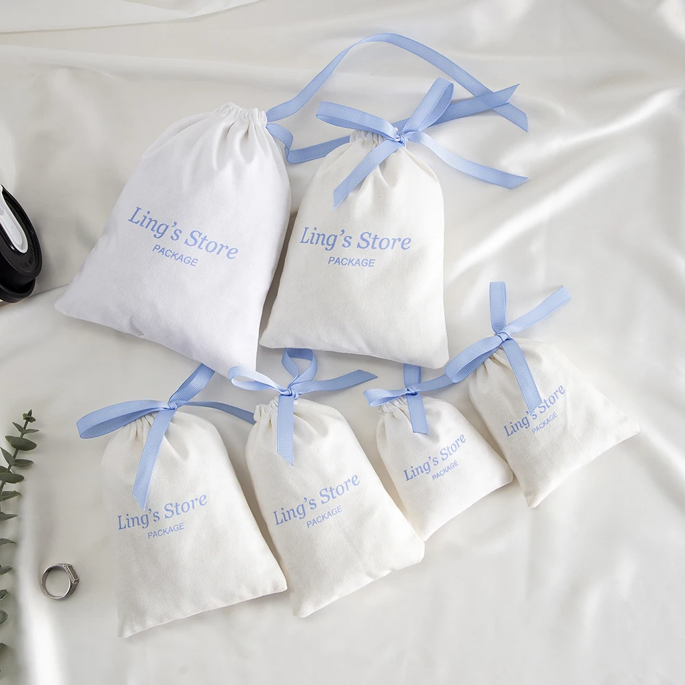 100Pcs Custom Logo White Cotton Jewelry Muslin Bag Canvas Ribbon Pouch For Ring Earrings Watch Sunglasses Headset Gift Organizer view 3