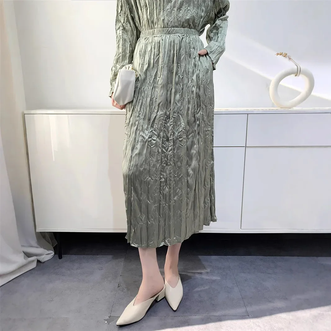 A two-piece suit for women Miyake Pleated Fashion loose round neck long sleeve T-shirt + straight skirt