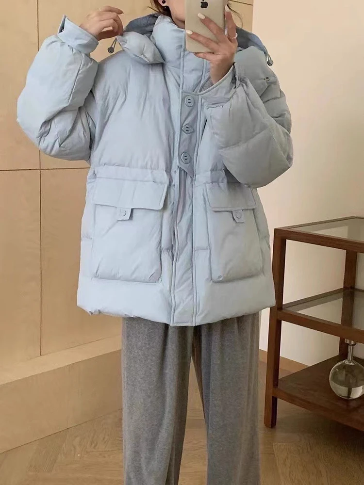 2025 neue Winter Verdickte Unten Jacke Frauen Einfarbig Mit Kapuze Temperament Taste Dekoration Mode Große Tasche Mantel