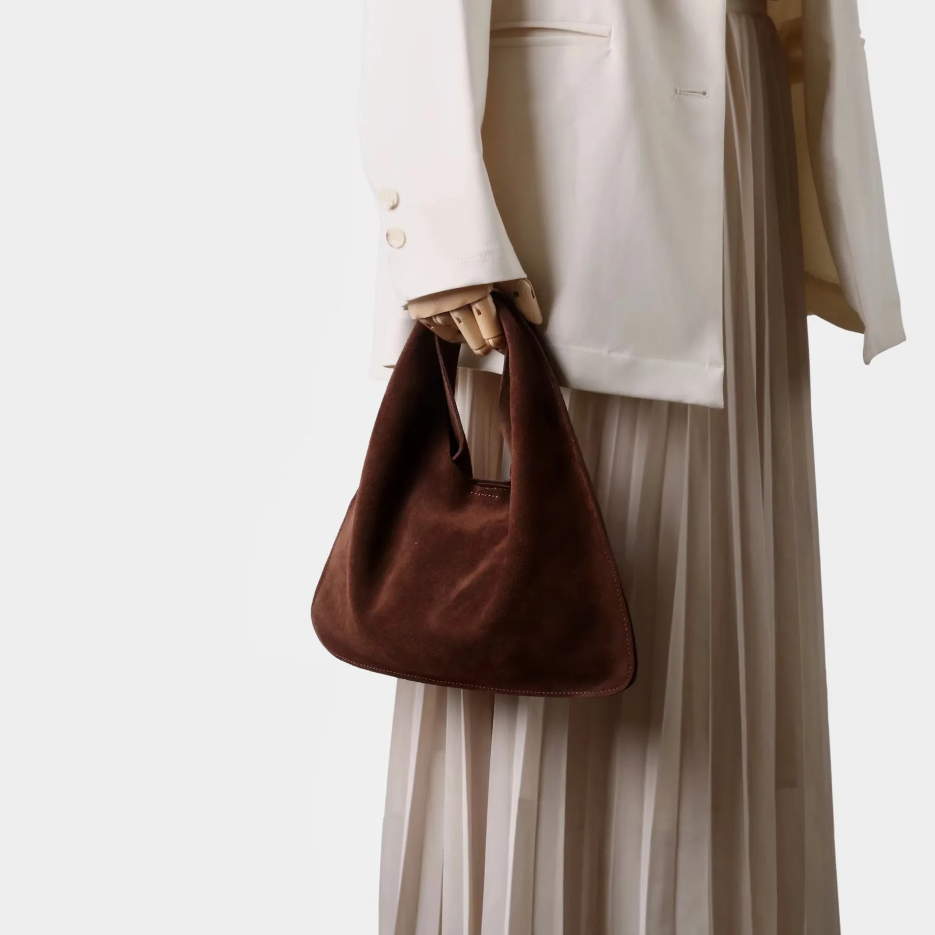 

2025 New Niche Design Frosted Cowhide Triangle Bag Fashionable Versatile Hand Carry Messenger Bag Retro High-end Women's Bag