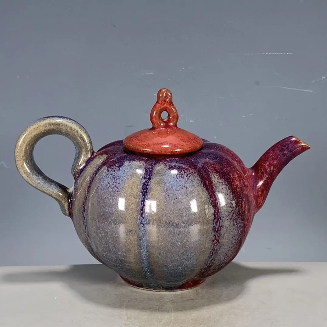 Replica of Chinese antiques and collectibles: Song Dynasty Jun ware kiln-transformed rose-red pumpkin teapot.