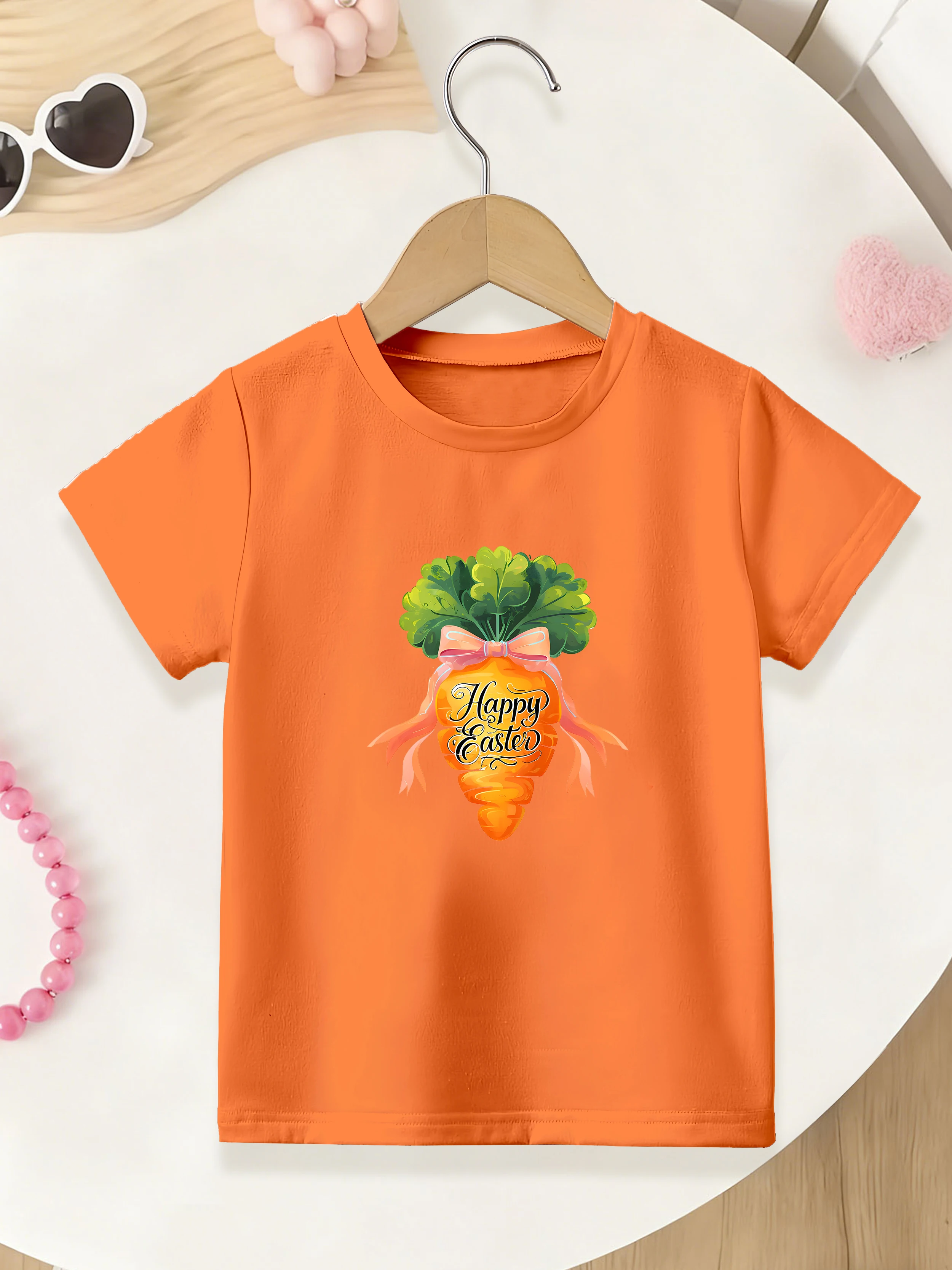 

1 шт.: Летняя футболка для девочек на Пасху с коротким рукавом и принтом мультяшной моркови с бантом