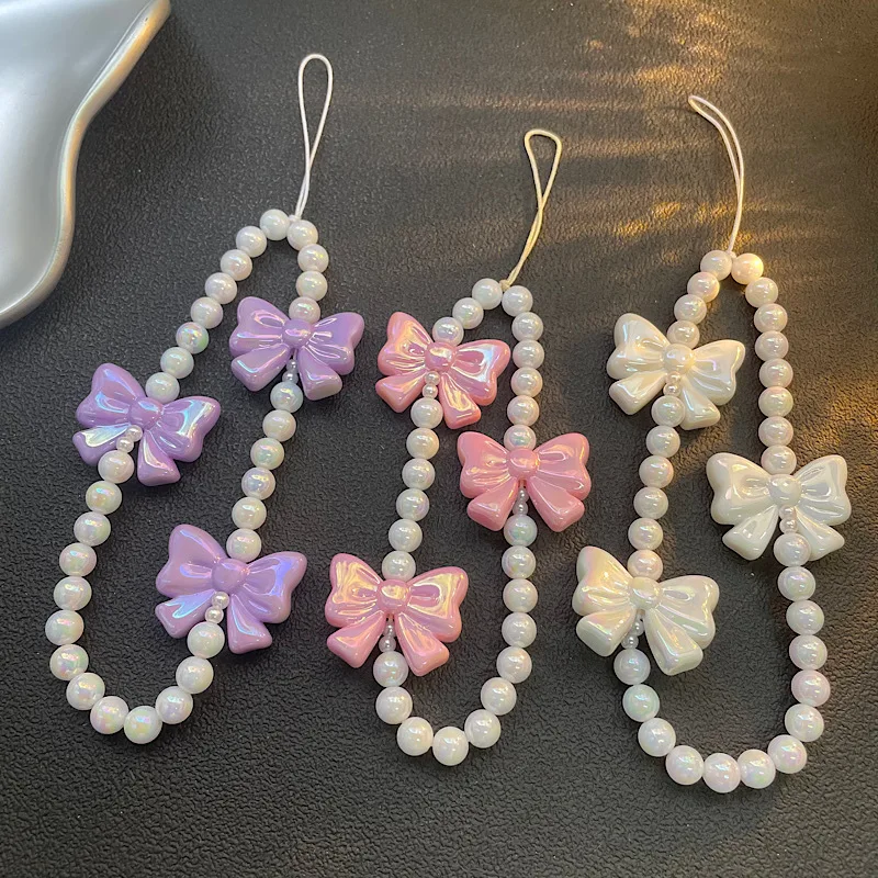 Cadena de teléfono de diseño original |   Cadena rosada del teléfono del arco de la perla, cadena CCD del teléfono del grano de la muchacha para el encanto lindo del teléfono del iPhone 17 16