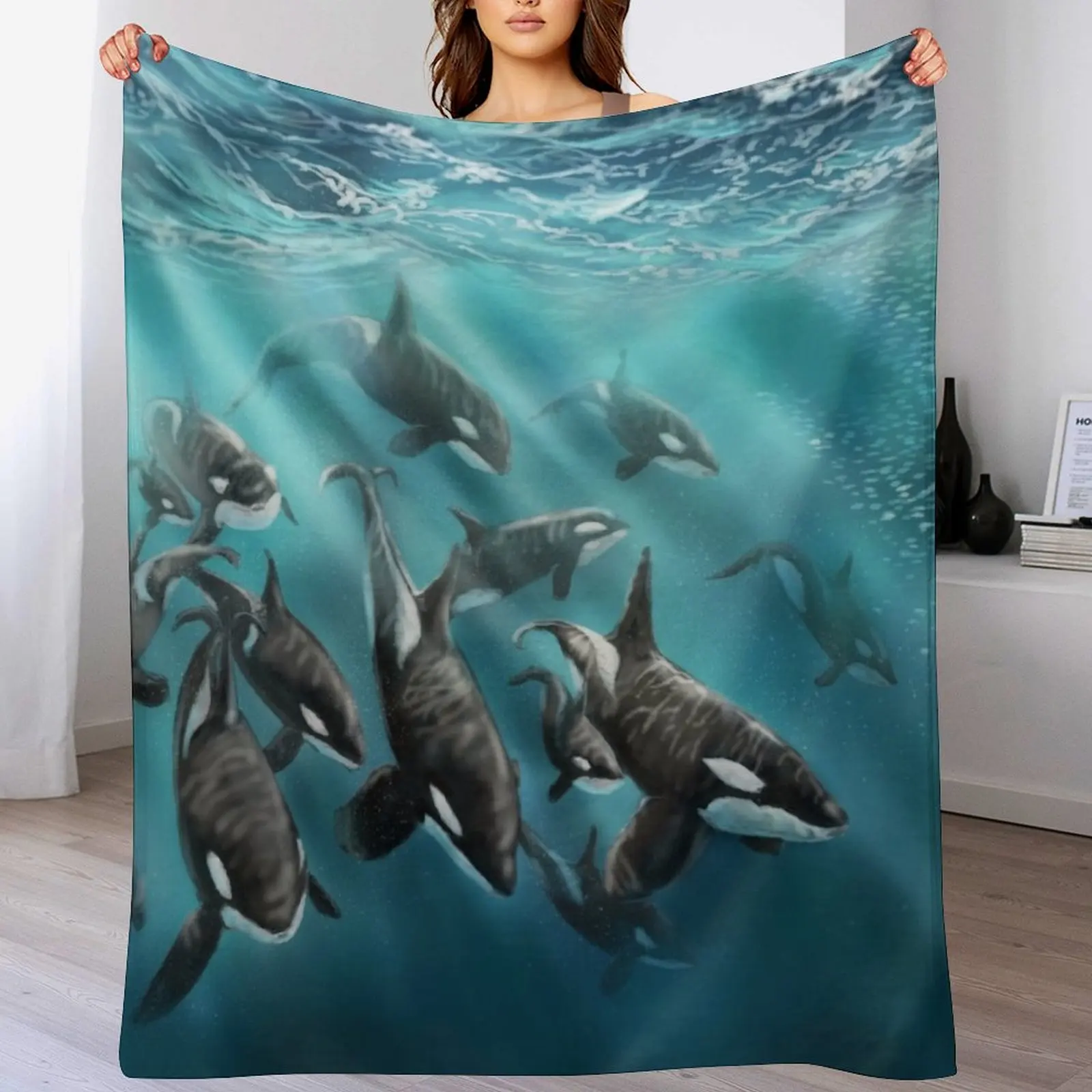 

An orca pod Throw Blanket