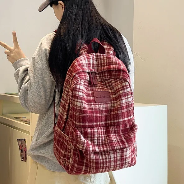 

Korean version of Ins Academy style woolen plaid backpack for women in spring 2025, new high-value backpack for students