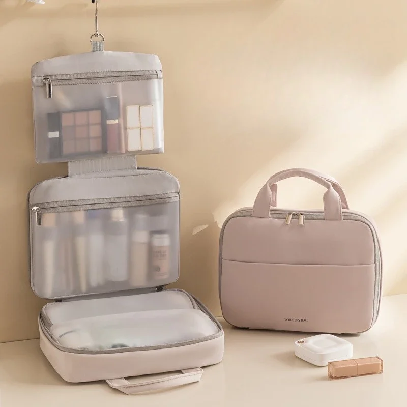 大容量の女性用化粧品バッグ - 防水の吊り下げ式メイクアップオーガナイザー、フックとハンドル付き、バスルームや旅行に最適