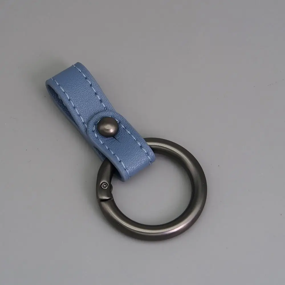 

Новые брелоки из искусственной кожи, суперлегкое кольцо из цинкового сплава, брелок из воловьей кожи, многофункциональная пряжка, уличный инструмент