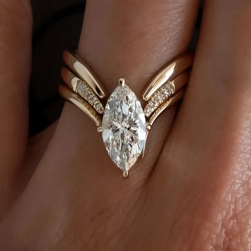 女性用結婚指輪 - マーキーズカットとラウンドカットの合成ジルコン象嵌リング、婚約、記念日、日常のエレガントな装いに最適 - 一年中使える万能な結婚指輪ギフト、絶妙なデザイン、精巧な職人技、ファッショナブルな選択肢 1