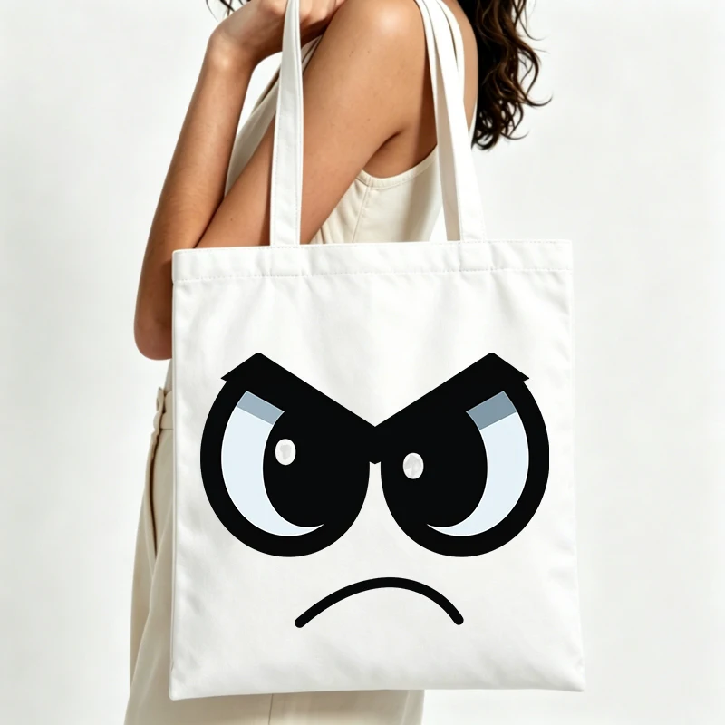 Women's canvas tote bag with angry eye graphic, casual style for daily shopping and weekend outings