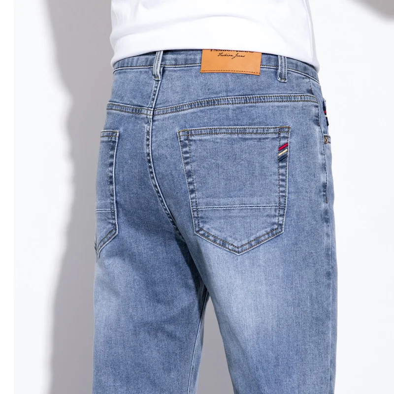 جينز قطني مرن للرجال عالي الجودة موضة أزرق فاتح مريح للأعمال سراويل مستقيمة غير رسمية سراويل ماركة فاخرة