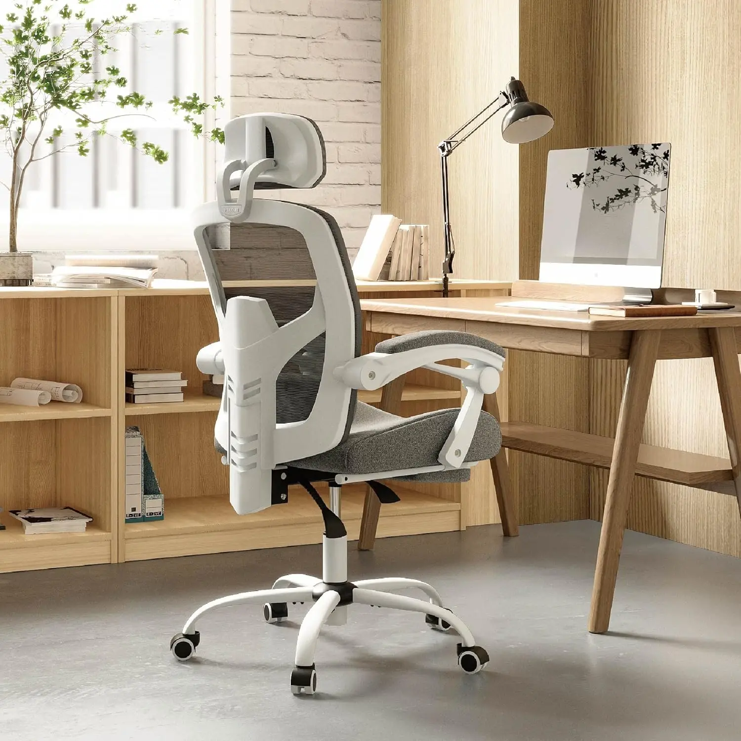 Office computer chair with footrest, ergonomic high-back mesh swivel chair with wheels, comfortable lumbar support, light gray.