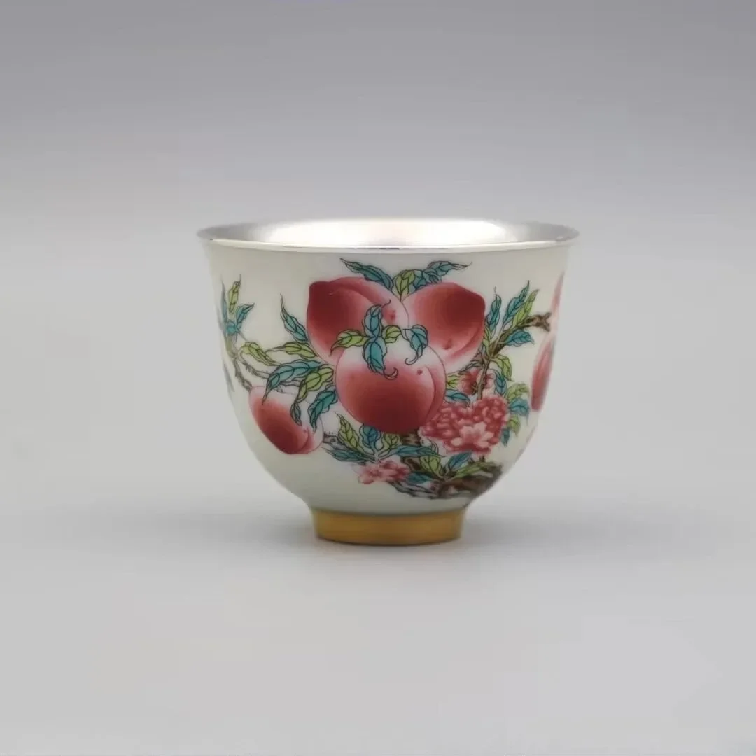 

Sterling silver liner, ceramic silver teacup, master cup