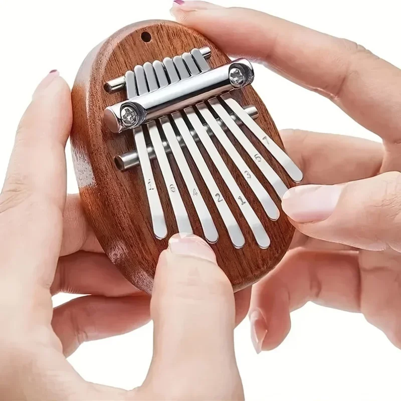Mini pianoforte a pollice a 8 toni, pianoforte portatile per dita artigianali, comoda impugnatura sonora tridimensionale