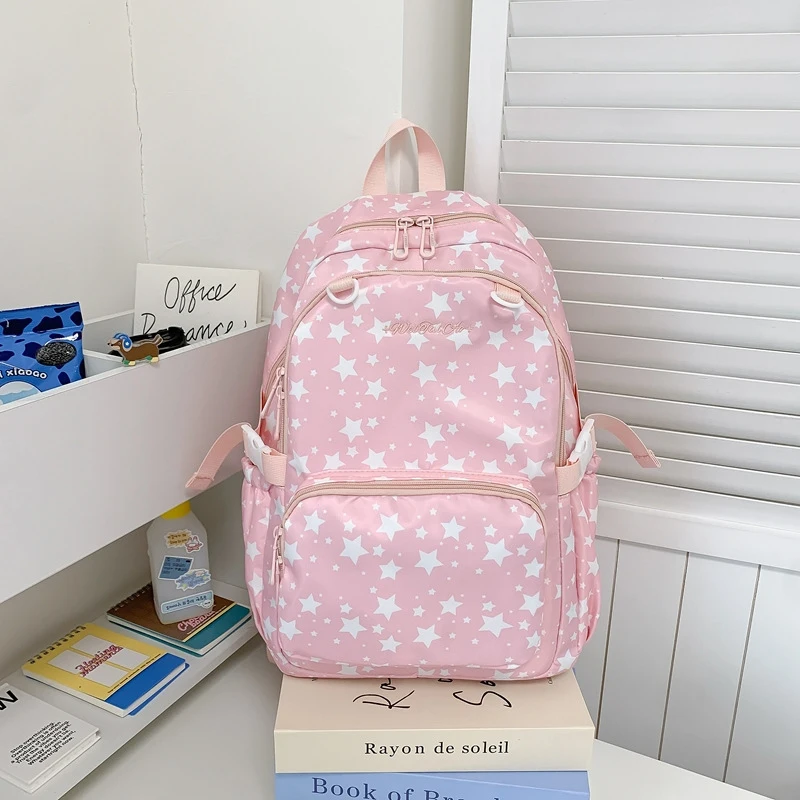 Korean-style star-patterned backpack for female junior high school students, large capacity, lightweight, simple design, high ae