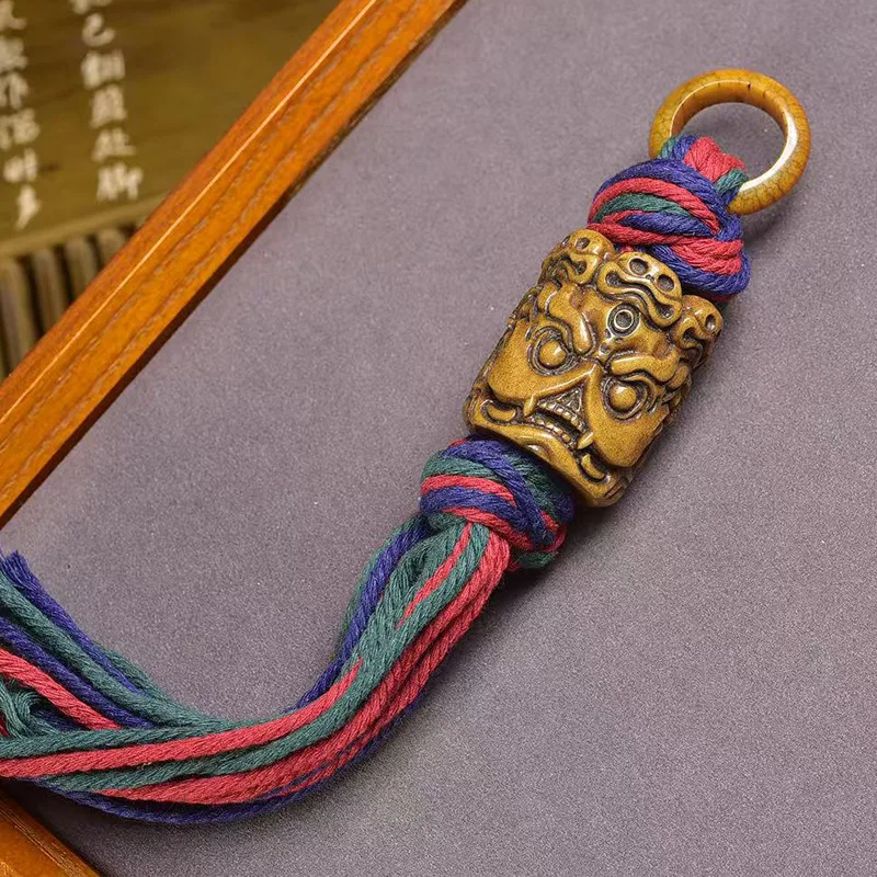 

Tibetan-Style Bone Carving Mahakala Handheld Pendant Tibetan-Style Handcrafted Cotton Rope Tassel Pendant