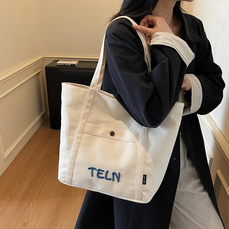 حقيبة كتف ذات سعة كبيرة على الطراز الكوري حقيبة حمل مريحة ومتعددة الاستخدامات حقيبة تخزين نسائية عصرية من القماش للتنقل