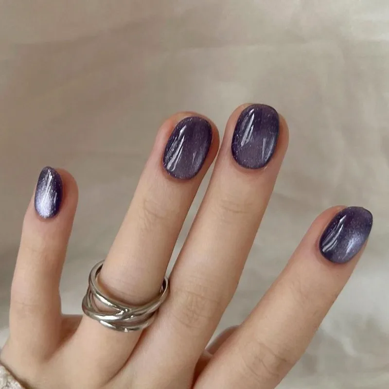

24 Pcs Short Round Press on Nails with Charms Reusable Fake Nails with Sticky Tabs Holiday Paste Nails Purple Cat Eye Nail Tips